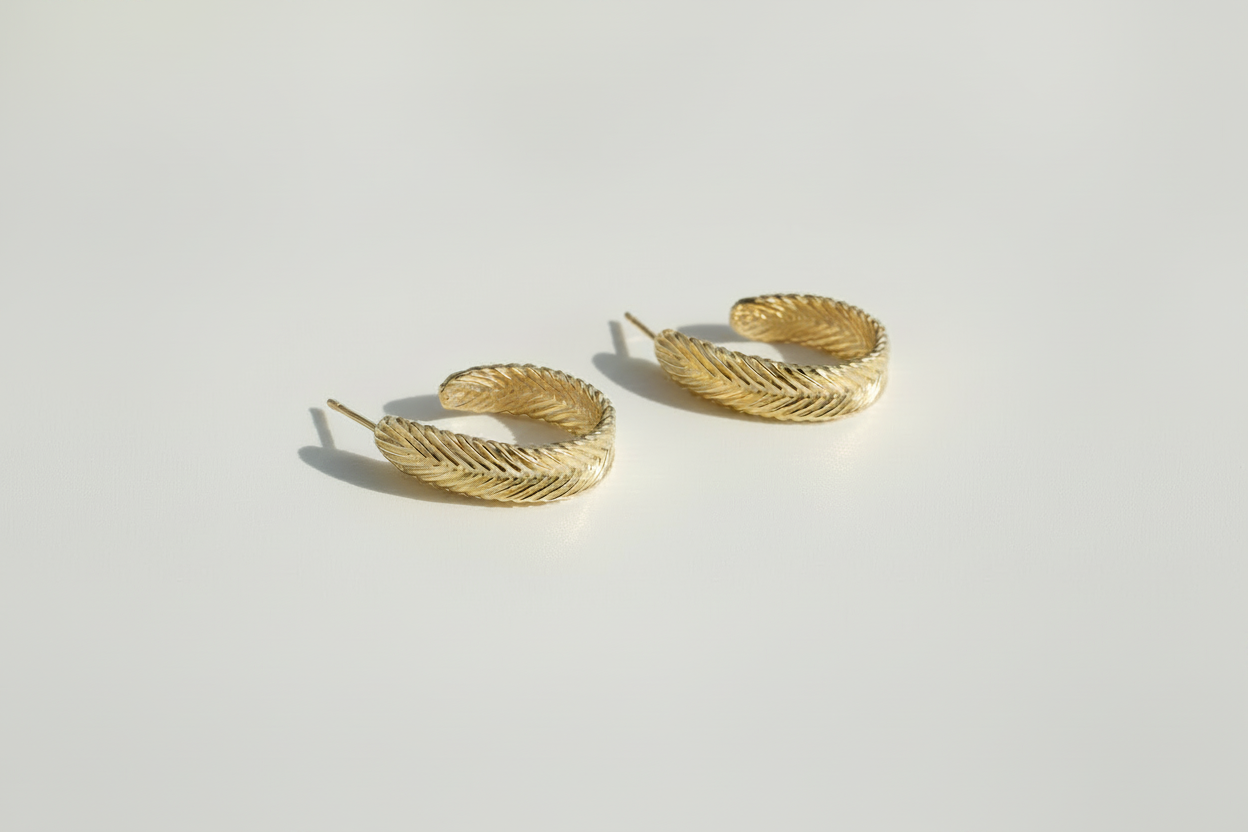 Gold vermeil Harmonia Woven Hoop Earrings featuring a handwoven herringbone texture by Kefi.