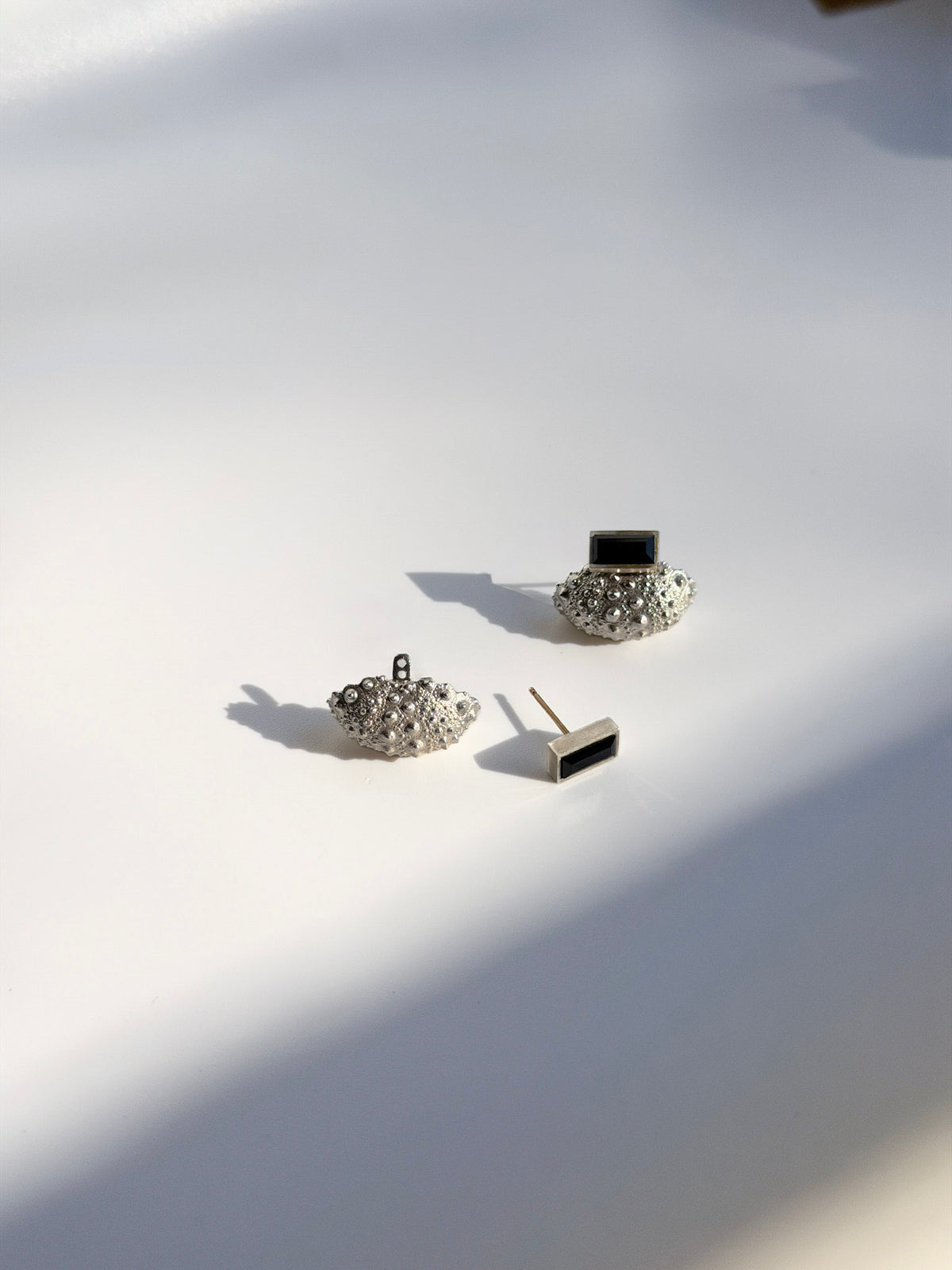 Ceto Urchin Earring Jacket and Spinel Post shown apart, showing how the post passes through the jacket