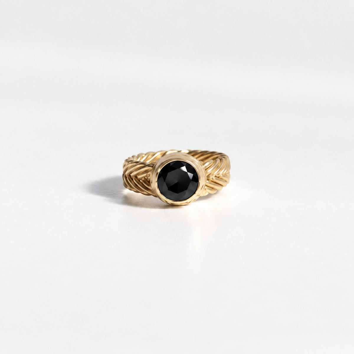 Classic Woven Solitaire Ring in gold vermeil with a round black spinel set in a handwoven band, handcrafted in New York City by Kefi
