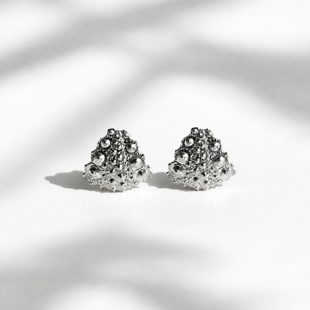 Galatea Tiny Urchin Earrings in sterling silver featuring a sculptural sea urchin-inspired texture, handcrafted in New York by Kefi.