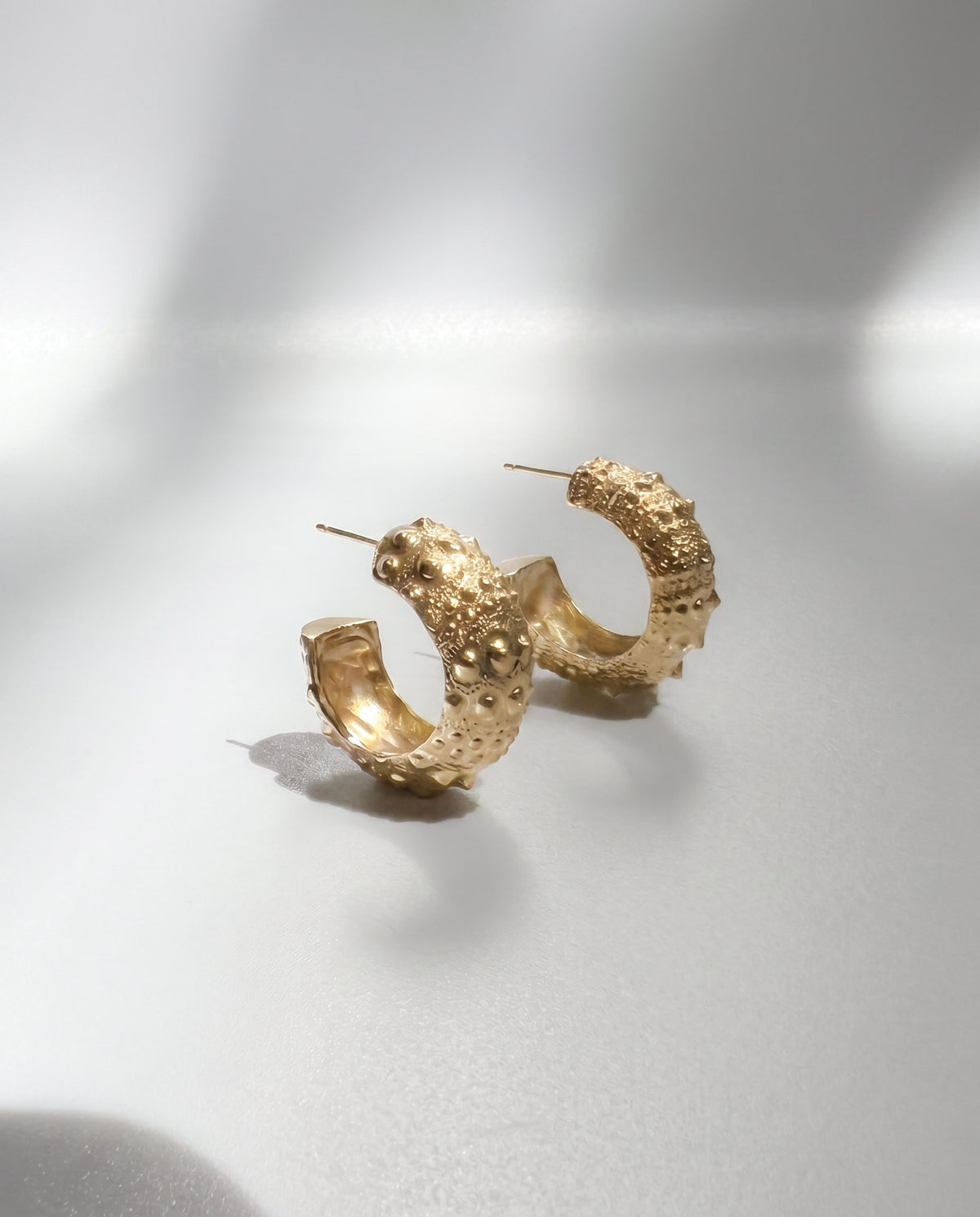Galatea Urchin Hoops in gold vermeil, hoop earrings cast from a sea urchin shell with its texture preserved