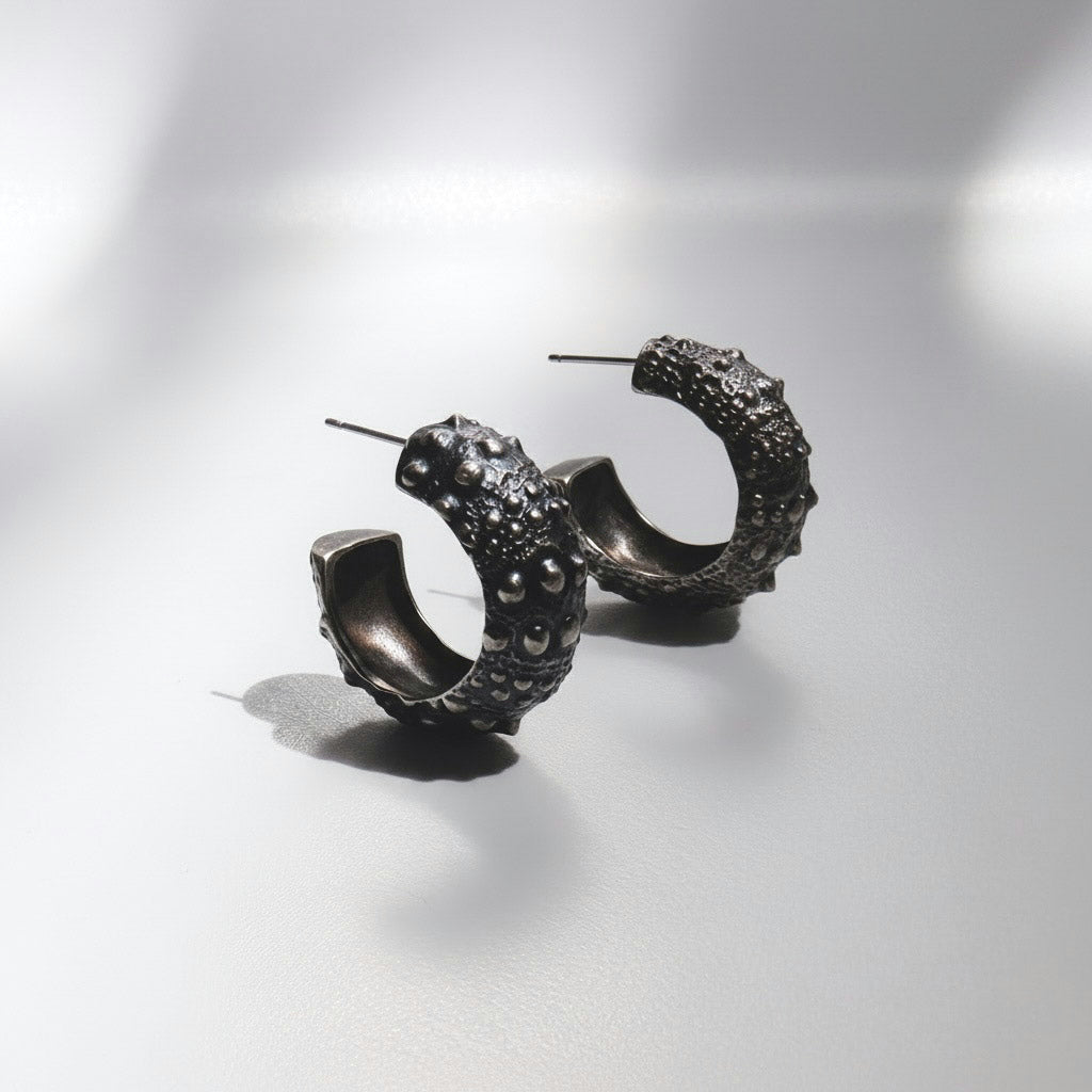 Galatea Urchin Hoops in oxidized sterling silver, the dark finish deepening the sea urchin texture