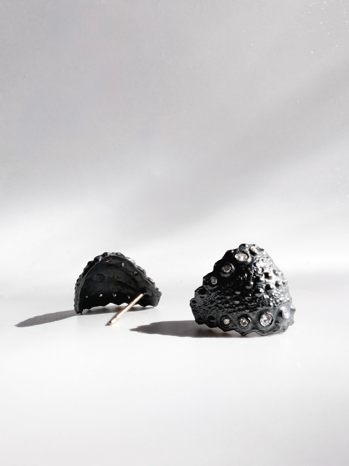 Galatea Urchin Hug Earrings in oxidized sterling silver with flush-set diamonds and preserved sea urchin texture