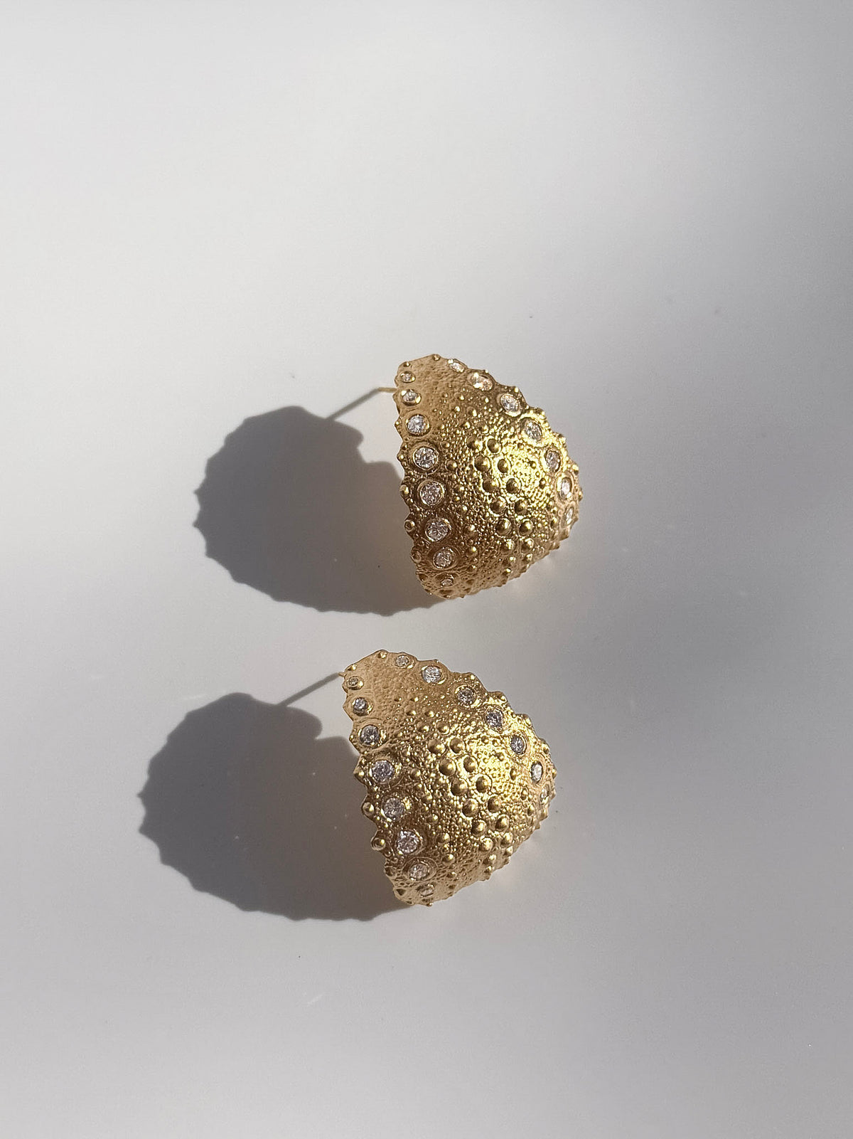 Pair of Galatea Urchin Statement Earrings in gold vermeil with diamonds, the sea urchin texture catching the light