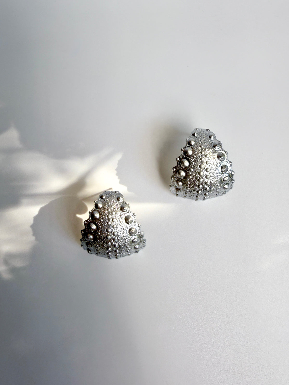 Galatea Urchin Statement Earrings in sterling silver, sculptural domes cast from a sea urchin shell, handcrafted in New York City by Kefi