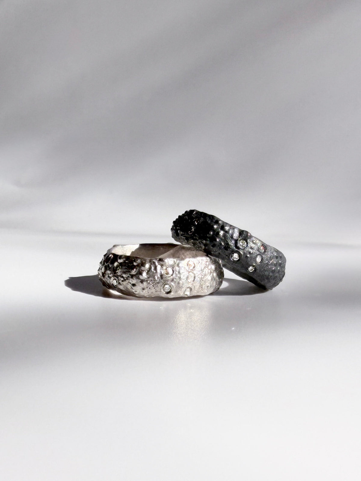 Galene Urchin Rings in sterling silver and oxidized sterling silver with flush-set diamonds and preserved sea urchin texture, handcrafted in New York City by Kefi