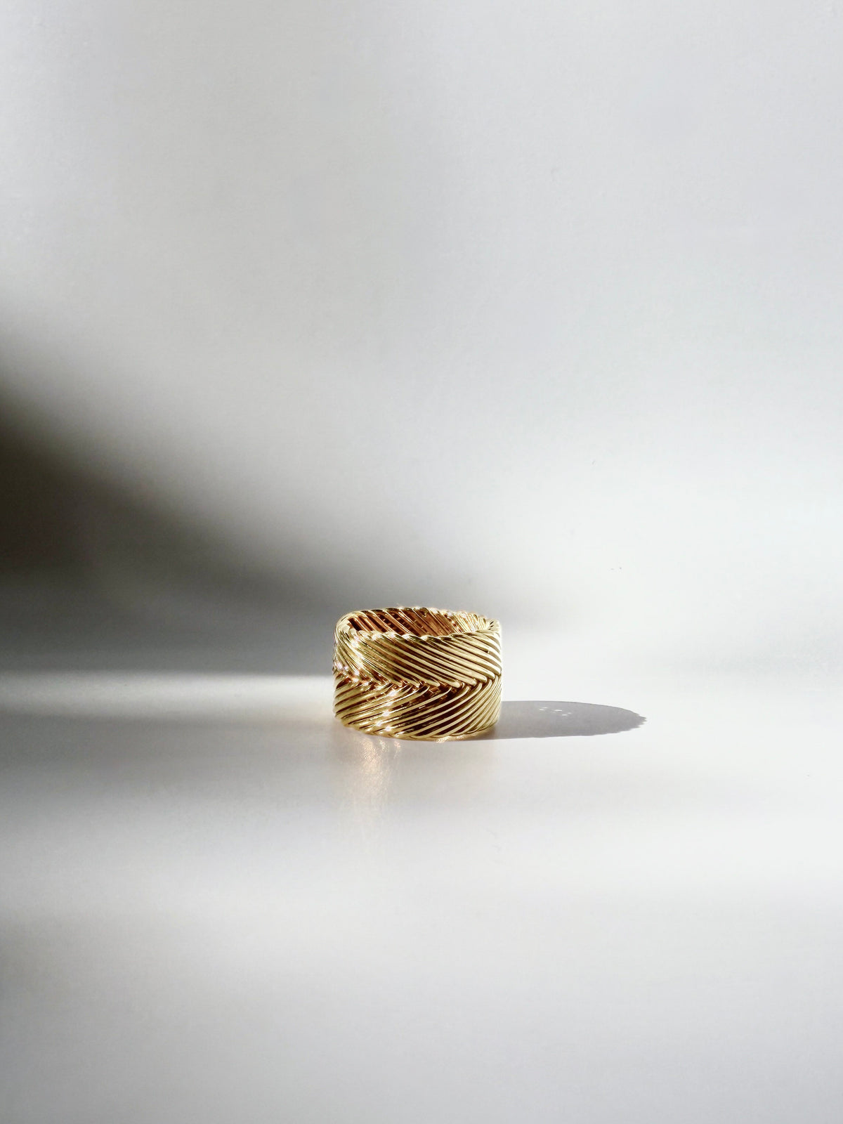 Tall Woven Ring in gold vermeil, a wide band with handwoven chevron texture, handcrafted in New York City by Kefi