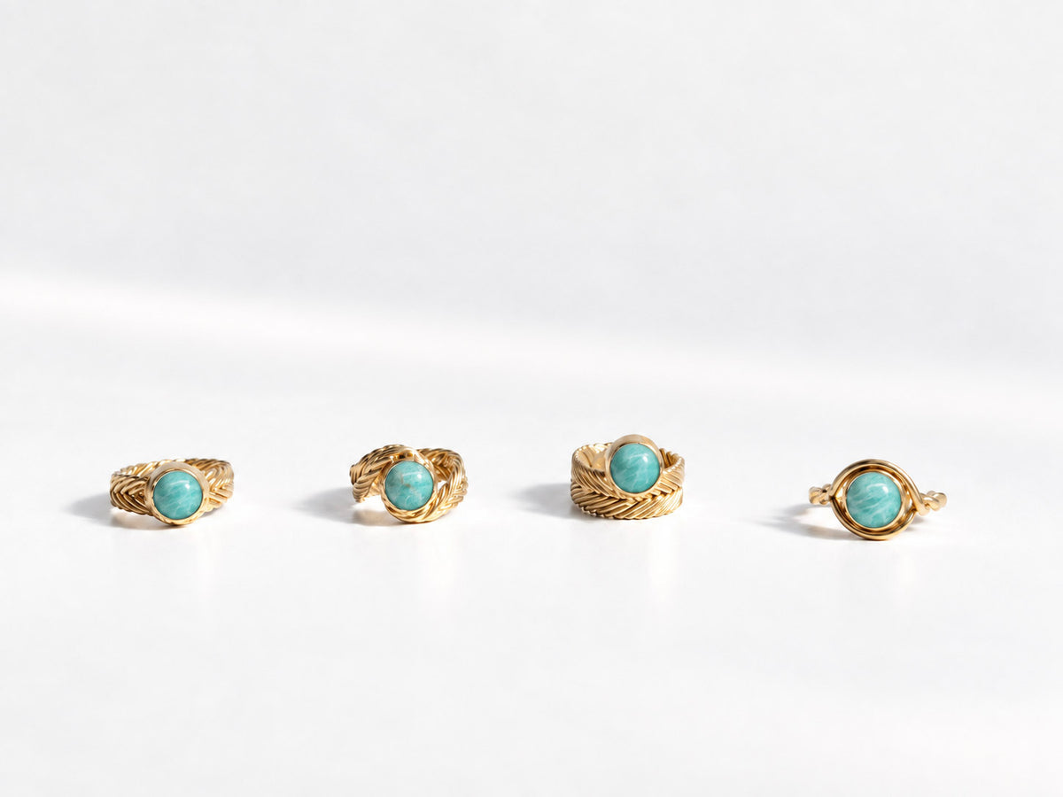 Four Woven Solitaire Rings in gold vermeil, each handwoven band set with a round amazonite stone