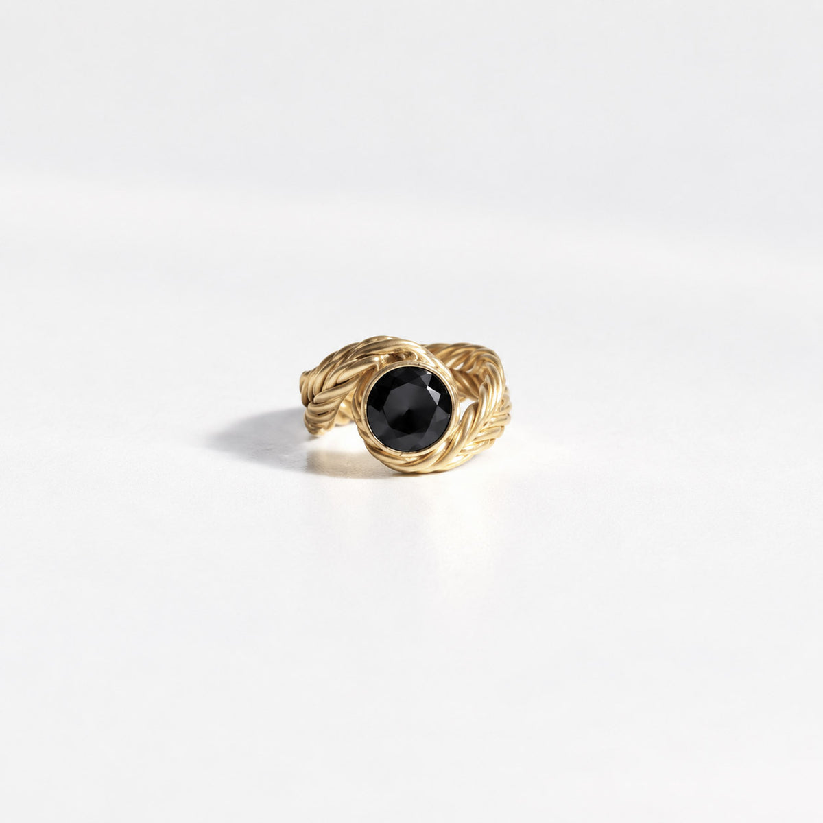 Woven Wrap Solitaire Ring in gold vermeil with a round black spinel held in a wrapped handwoven band