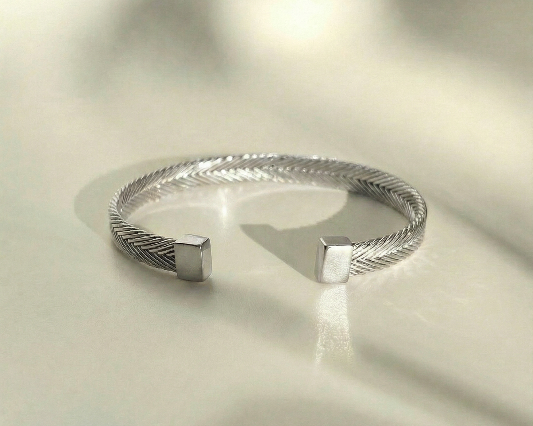Persephone Woven Cuff in sterling silver with intricate handwoven texture and structured silhouette