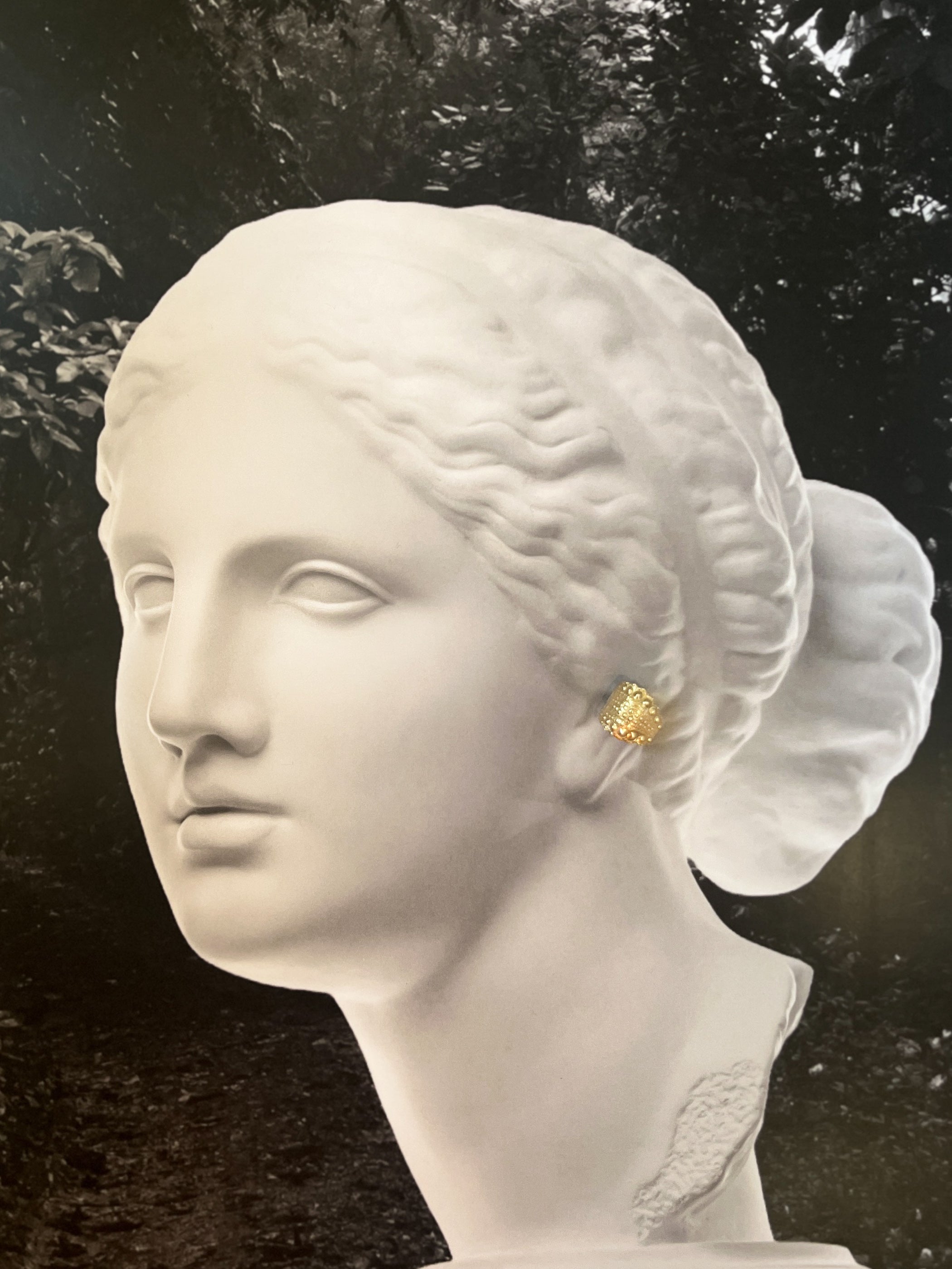 Bust wearing Urchin Cuff in gold vermeil, showcasing preserved sea urchin shell texture and statement cuff design