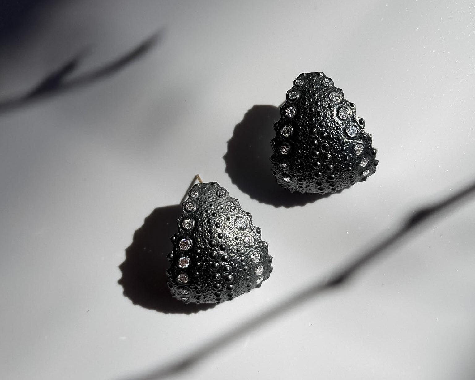 Urchin Hoop Earrings in oxidized sterling silver with natural sea urchin texture and sculptural hoop form