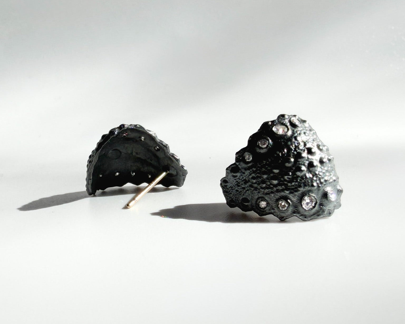 Urchin Hug Earrings in oxidized sterling silver with natural sea urchin texture and organic hoop form with diamonds