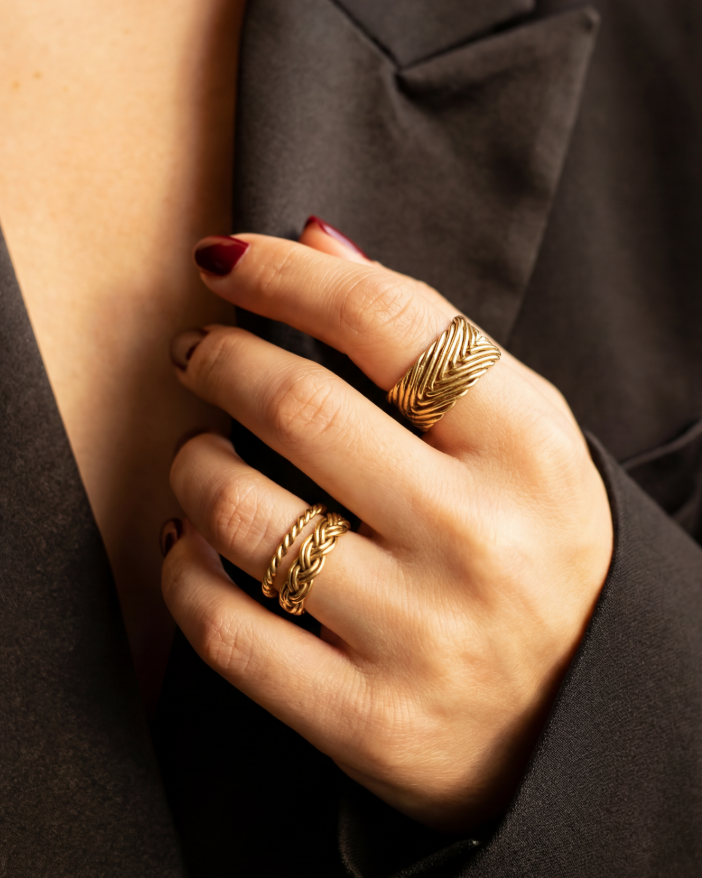 Model wearing Braided Ring in gold vermeil, showcasing handwoven braided band and refined finish