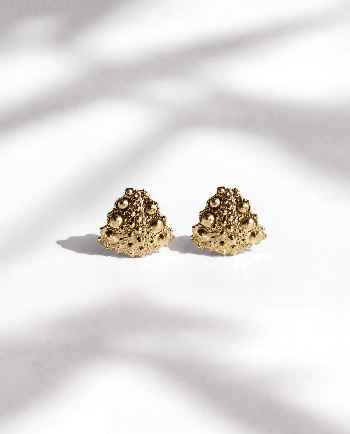 Galatea Tiny Urchin Earrings in gold vermeil, small stud earrings cast from sea urchin shells, handcrafted in New York City by Kefi