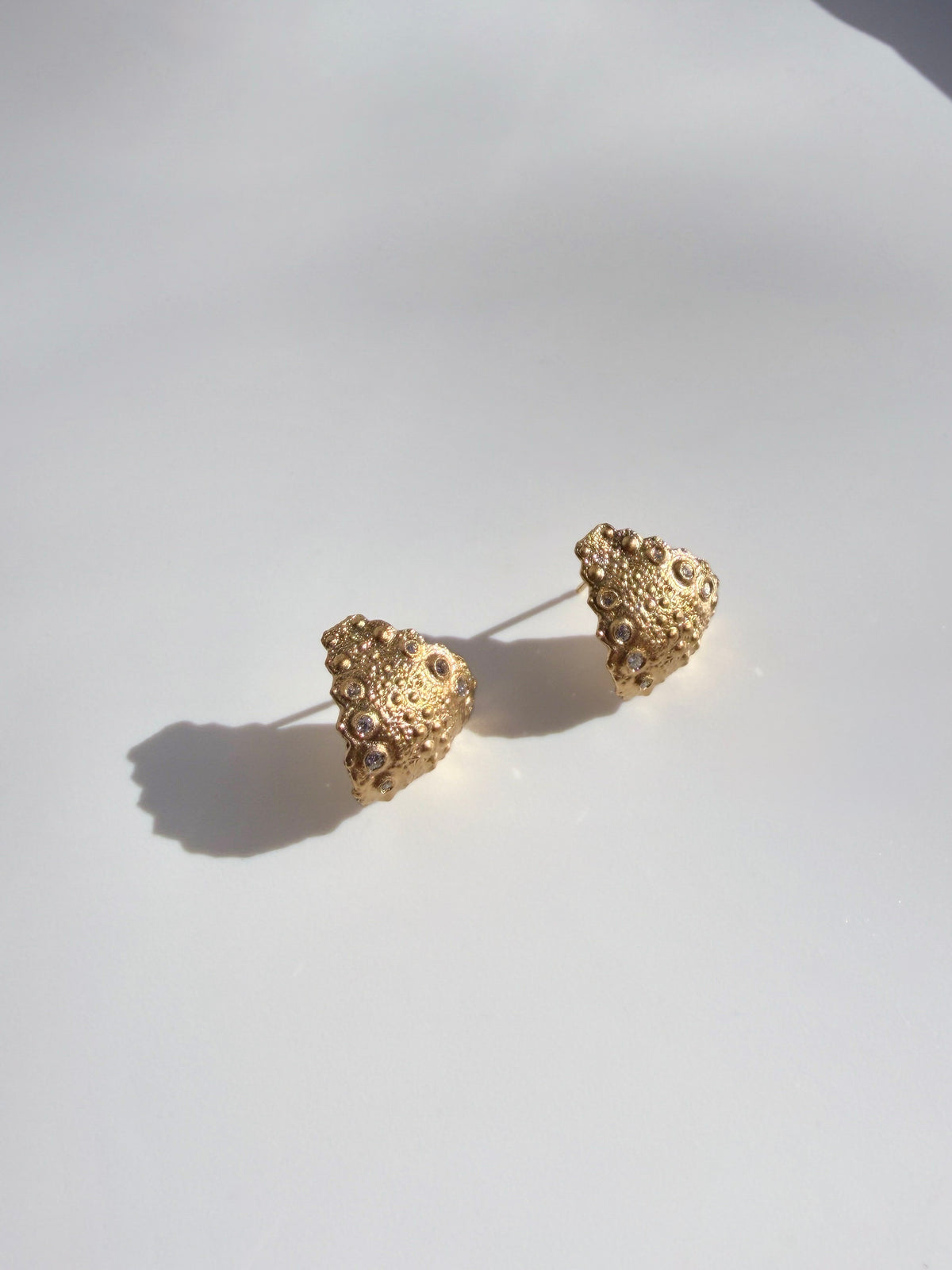 Galatea Urchin Hug Earrings in gold vermeil with flush-set diamonds, lightweight earrings cast from a sea urchin shell that hug the earlobe, handcrafted in New York City by Kefi