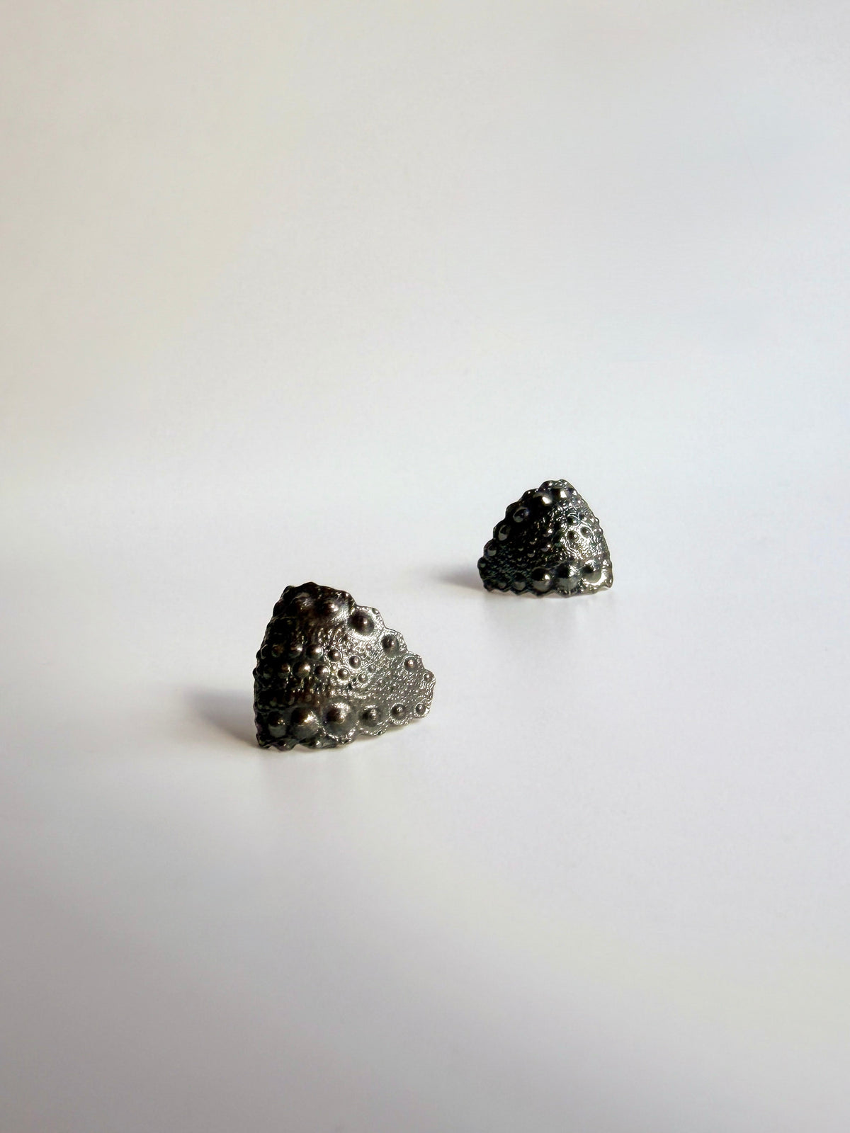Galatea Urchin Hug Earrings in oxidized sterling silver, the dark finish bringing out the sea urchin ridges
