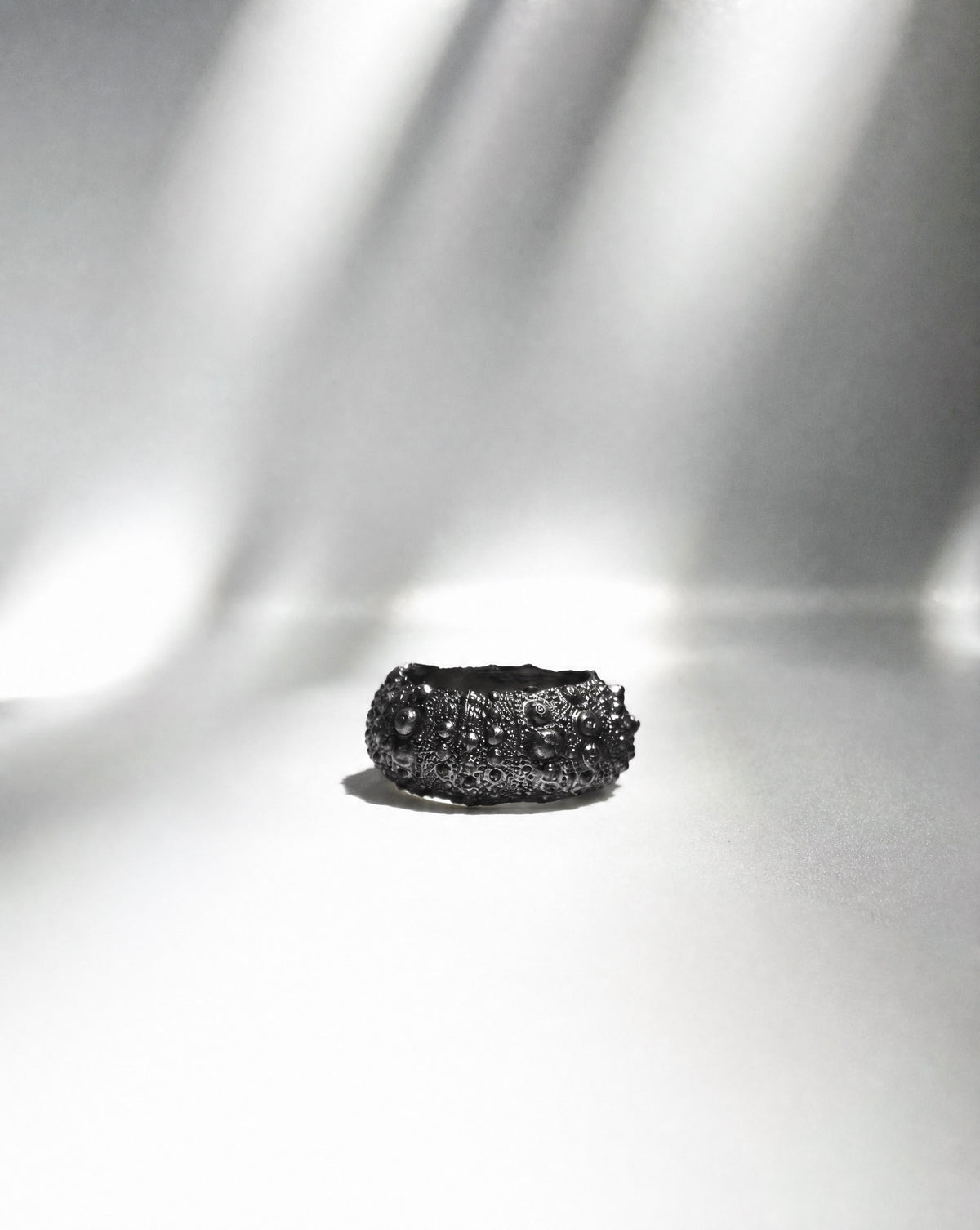 Galene Urchin Bold Ring in oxidized sterling silver, the dark finish deepening the sea urchin texture