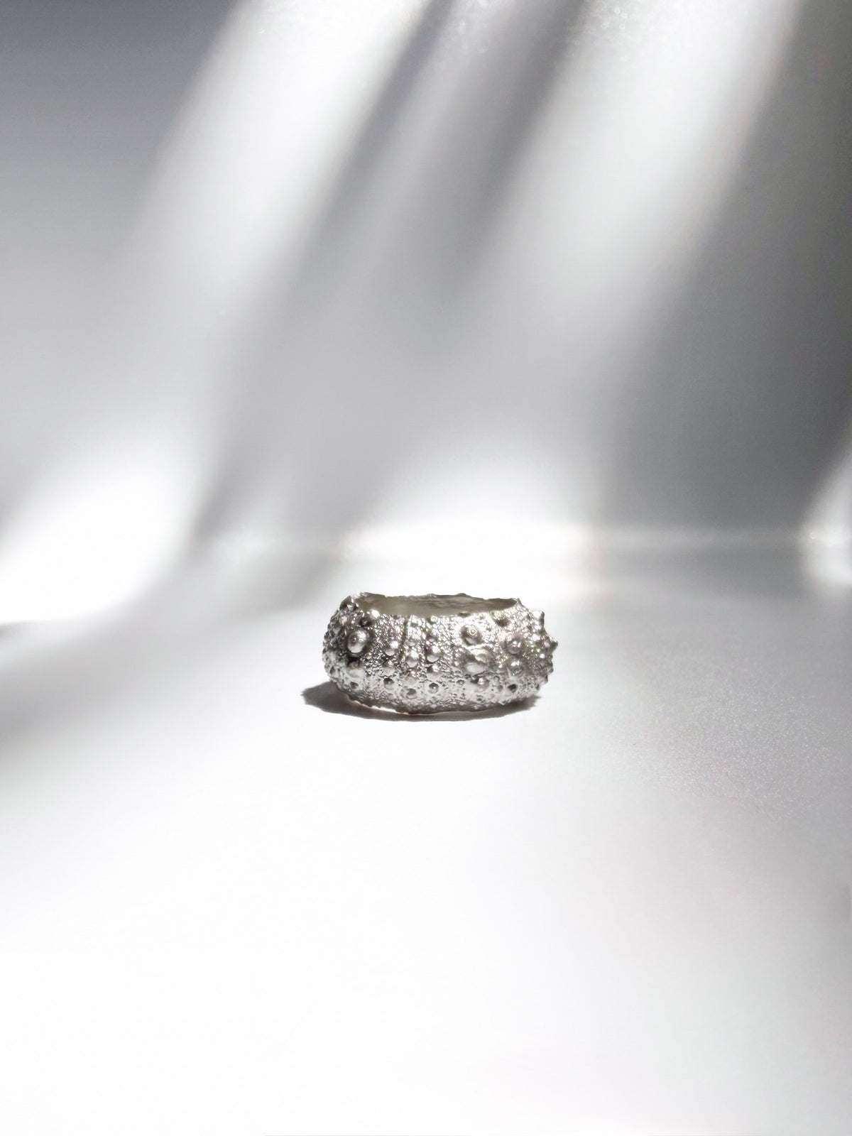 Galene Urchin Bold Ring in sterling silver, a wide band cast from a sea urchin shell, handcrafted in New York City by Kefi