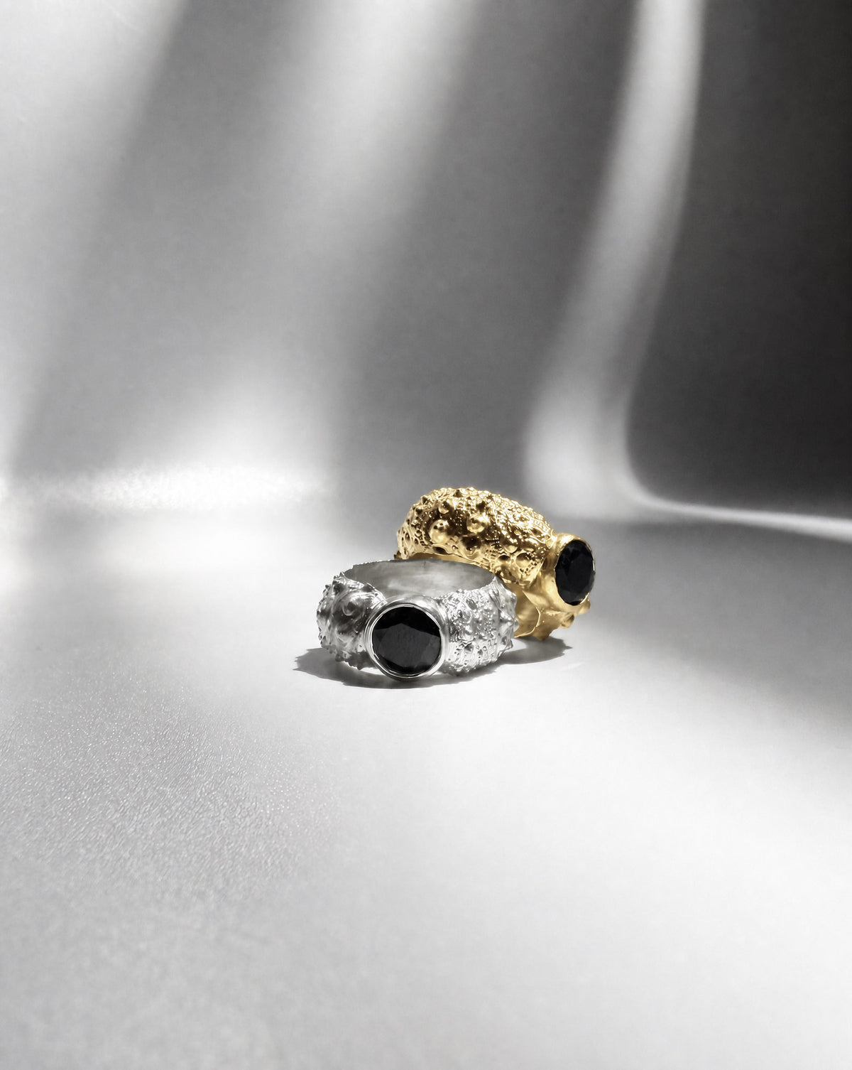 Galene Urchin Stone Rings in gold vermeil and sterling silver, each bezel set with black spinel, cast from a sea urchin shell