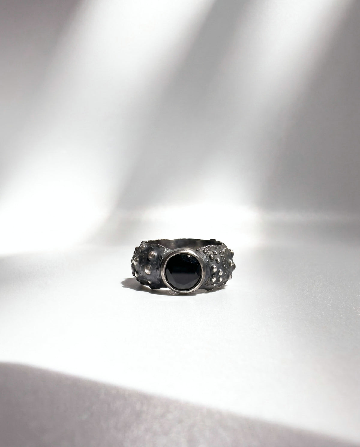 Galene Urchin Stone Ring in oxidized sterling silver with a bezel-set black spinel, handcrafted in New York City by Kefi