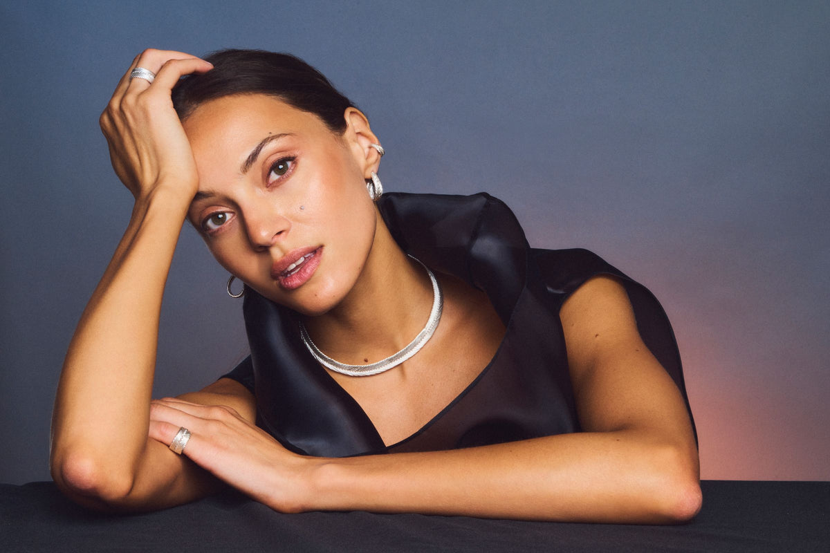 Model wearing Heritage Collection pieces in sterling silver, a woven collar and rings