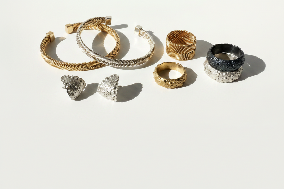 Selection of Kefi Jewelry pieces from the Urchin and Heritage Collections, featuring handcrafted sterling silver and gold vermeil designs inspired by coastal textures, heirloom forms, and meaningful adornment.