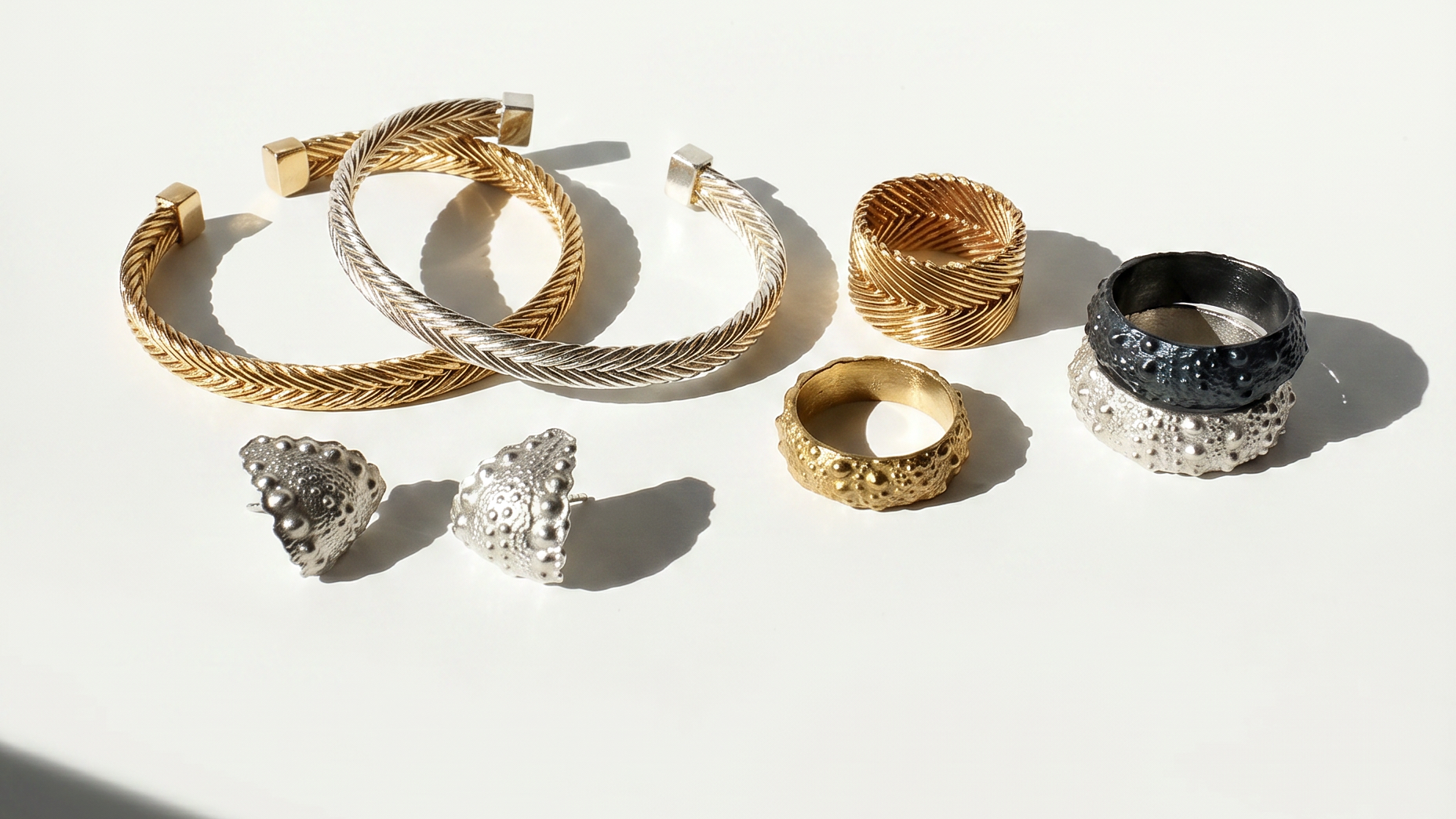Selection of Kefi Jewelry pieces from the Urchin and Heritage Collections, featuring handcrafted sterling silver and gold vermeil designs inspired by coastal textures, heirloom forms, and meaningful adornment.