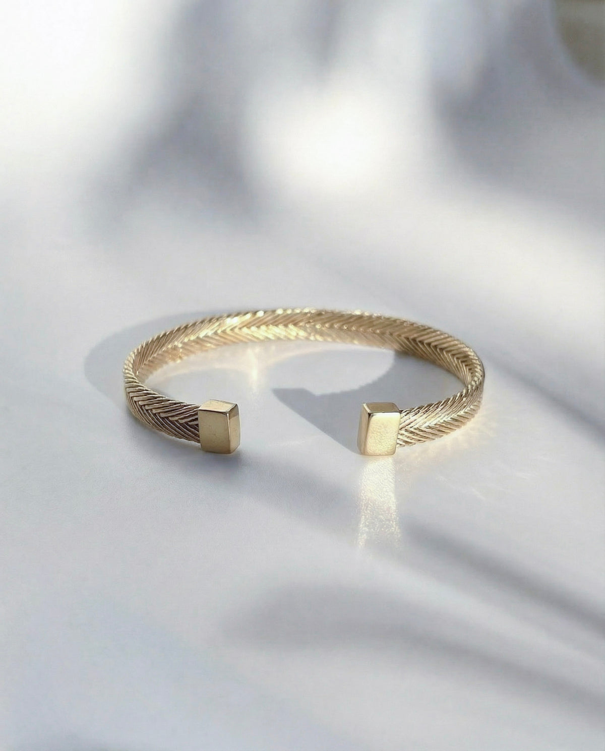 Persephone Woven Cuff in gold vermeil, a slim handwoven cuff bracelet with an open, gently adjustable form