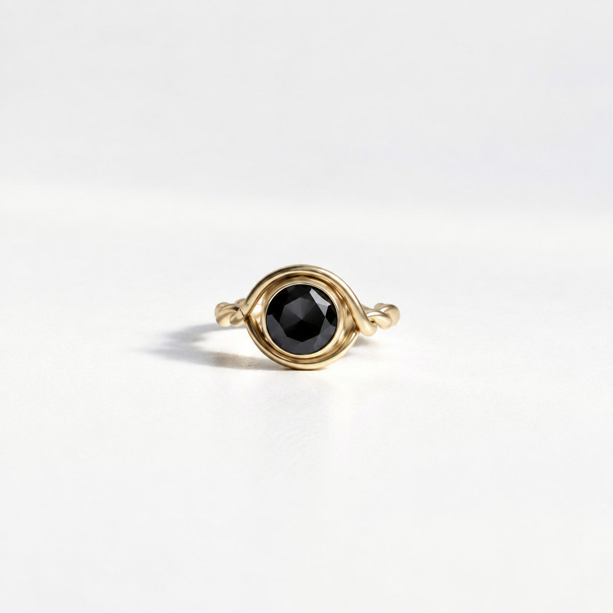 Twist Woven Solitaire Ring in gold vermeil with a round black spinel set in a handwoven twisted band