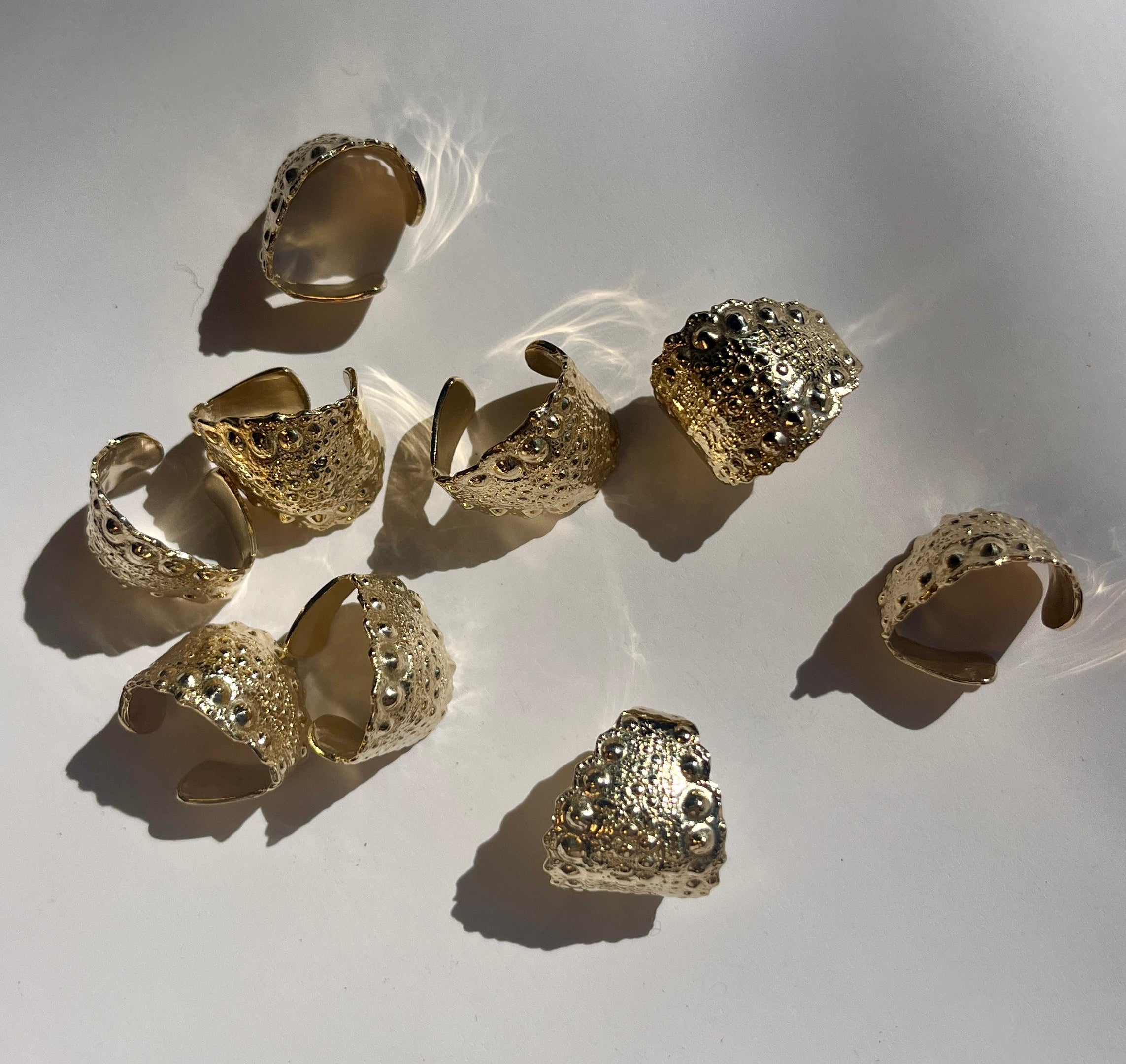 Urchin Cuff in gold vermeil with preserved sea urchin shell texture and sculptural cuff silhouette by Kefi