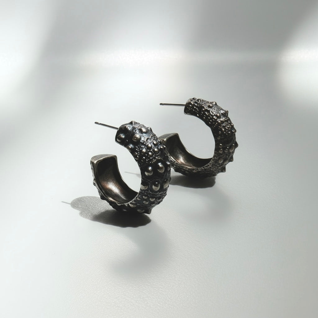 Urchin Hoop Earrings in oxidized sterling silver featuring sculptural sea urchin-inspired textures and an organic coastal design, handcrafted in New York City.