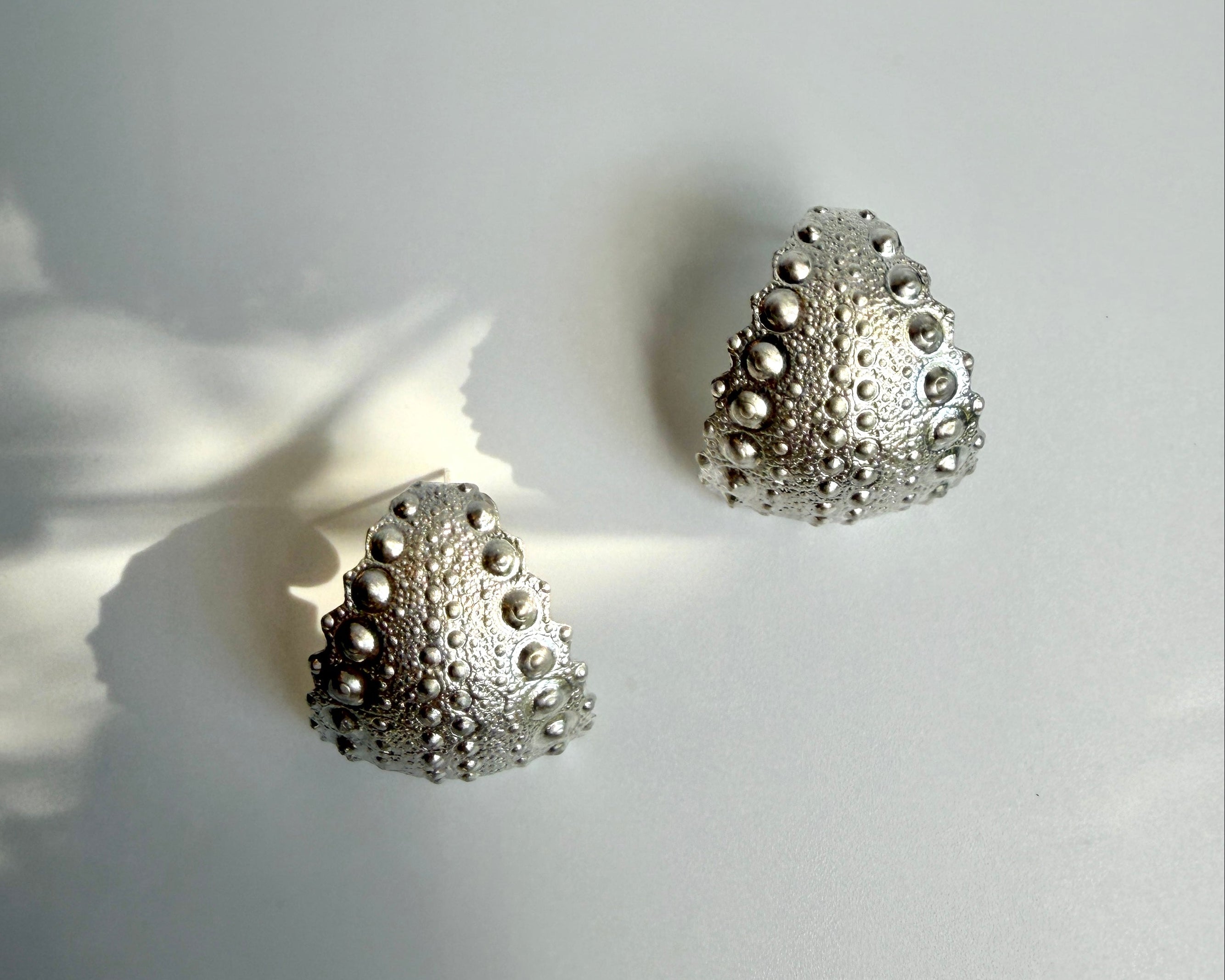 Urchin Hoop Earrings in sterling silver with natural sea urchin texture and sculptural hoop form