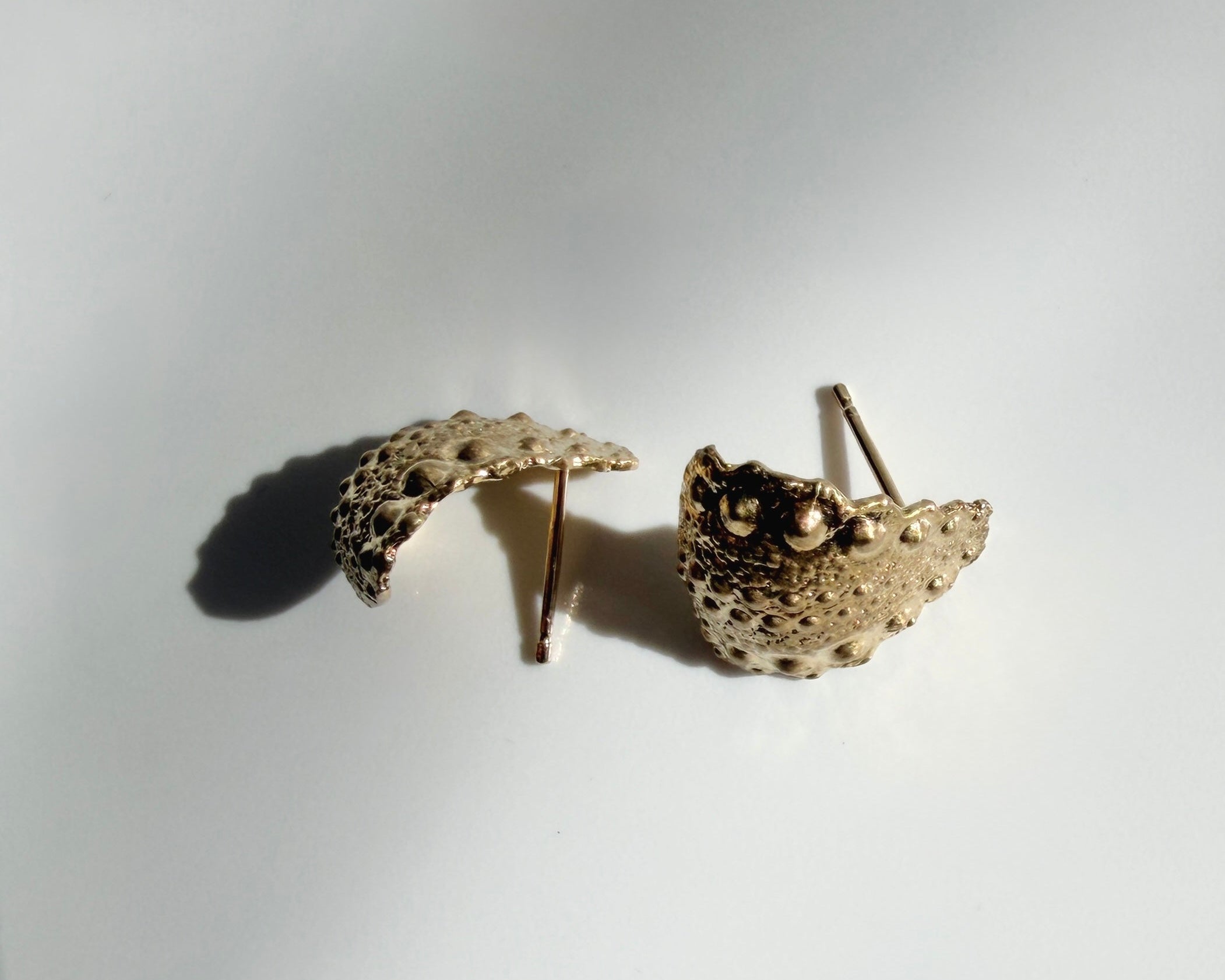 Urchin Hug Earrings in gold vermeil with preserved sea urchin shell texture and sculptural hoop design by Kefi