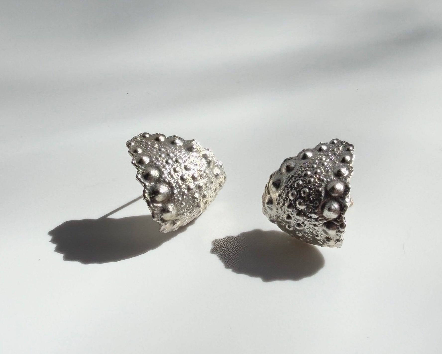 Urchin Hug Earrings in sterling silver with natural sea urchin texture and organic hoop form